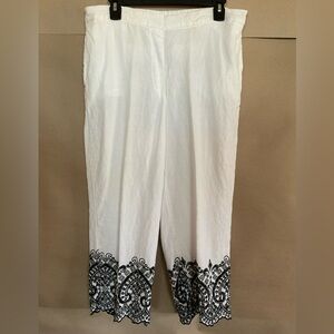Chico's white capris with black lace detailing at the hem. Size 2. 100% linen.